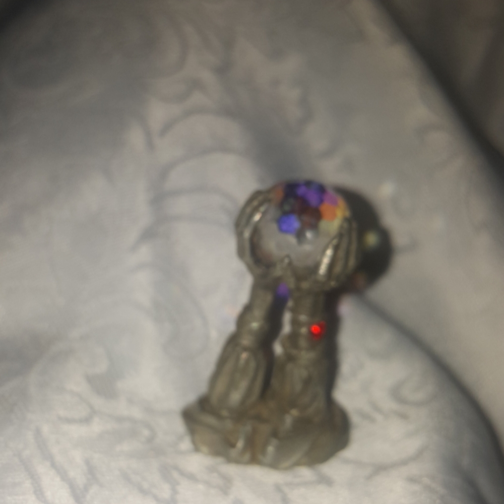 Vintage pewter figurine of wizard hands; one ruby